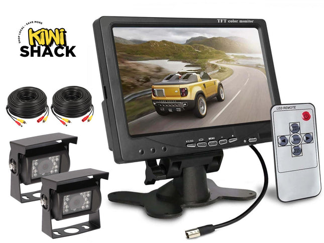 Car monitoring system with monitor, cameras, cables, and remote control on a white background.