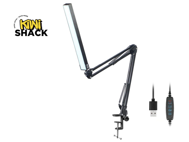 Black adjustable desk lamp with USB cable on a white background, featuring Kiwi Shack logo.