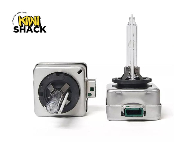 Two car headlights with a Kiwi Shack logo on a white background