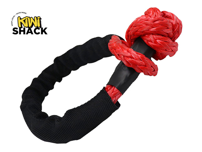 Black and red dog toy with a knotted design on a white background, featuring the Kiwi Shack brand.