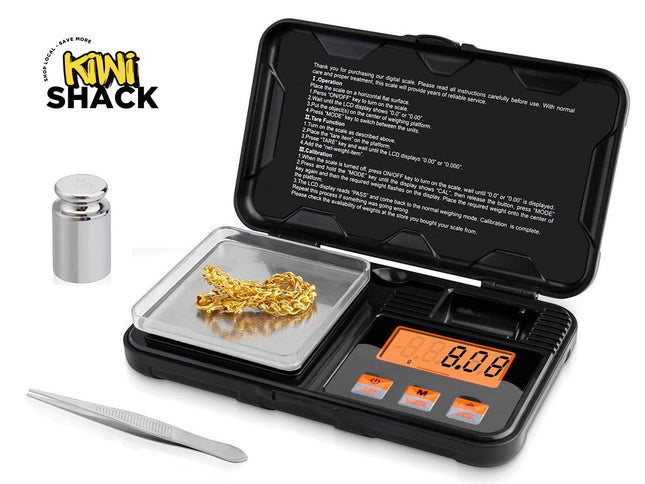 Digital pocket scale with gold leaf and tweezers on a white background, featuring Kiwi Shack branding.