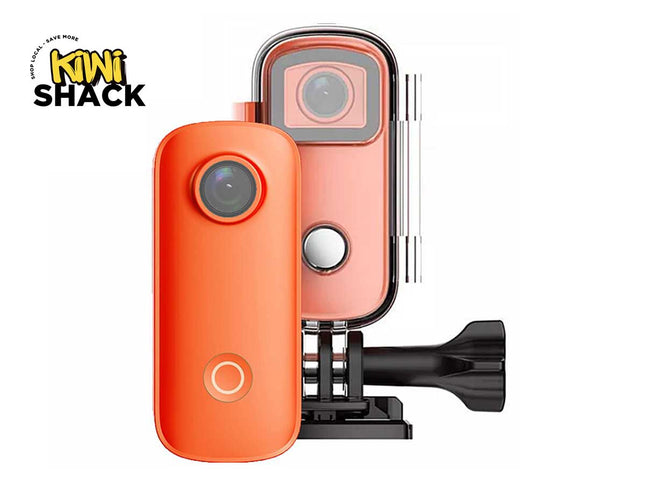 Orange and pink camera with a Kiwi Shack logo on a white background
