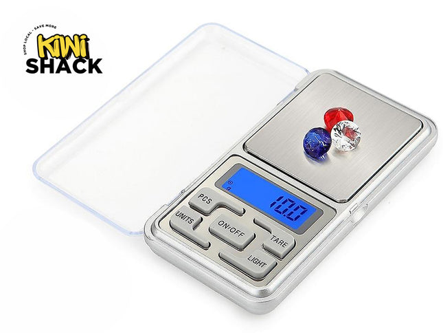 Digital pocket scale with two colorful stones on a white background, branded 'Kiwi Shack'.