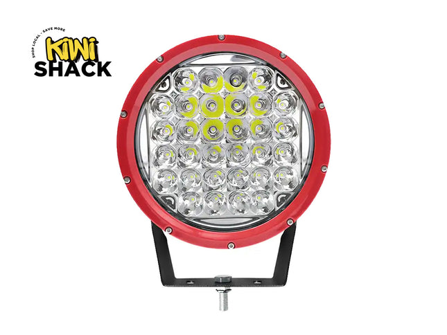 Round LED work light with red rim and black base on a white background, branded with Kini Shack.