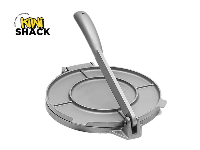 Metal tortilla press with a spoon on a white background, featuring the Kiwi Shack logo.