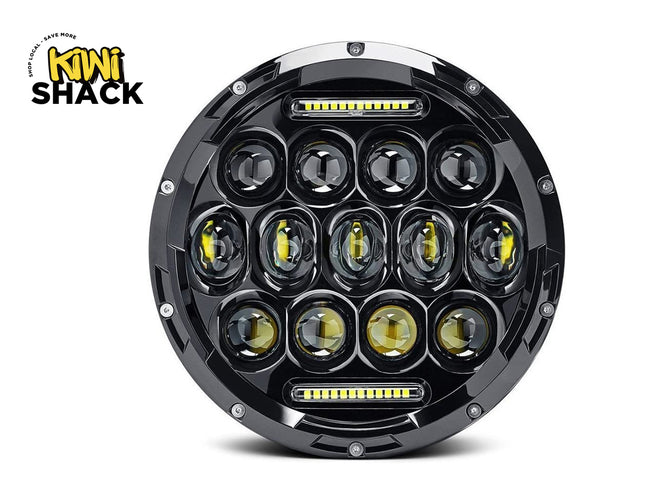 Round LED light with multiple lenses on a white background, featuring the Kiwi Shack logo.