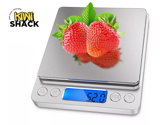 Digital kitchen scale with two strawberries on a white background, featuring the Kiwi Shack brand.