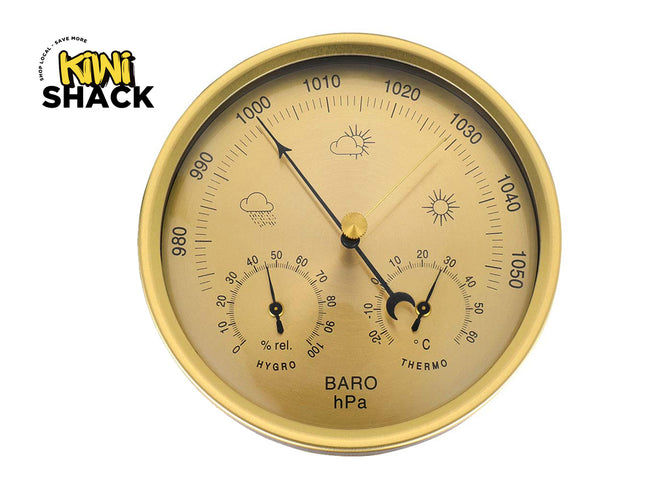 Gold barometer with weather symbols on a white background, featuring the Kiwi Shack logo.