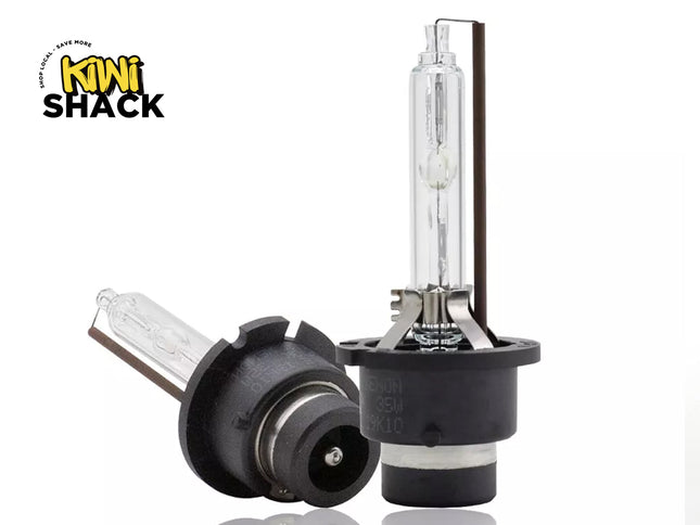 Two car headlights with a Kiwi Shack logo on a white background