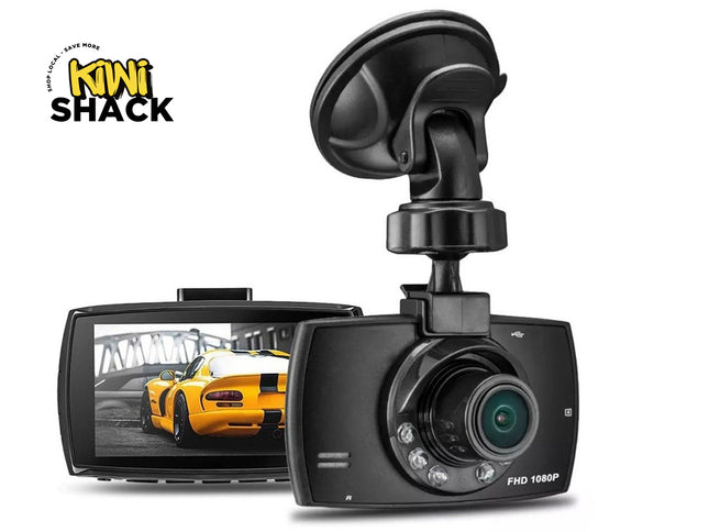 Car dashboard camera with screen displaying a yellow car, branded 'Kiwi Shack'.