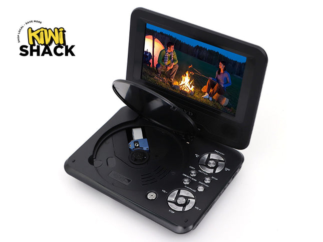 Portable DVD player with screen displaying a scene of people around a campfire, branded 'Kiwi Shack'.