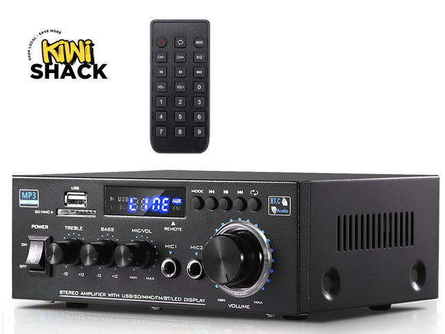 Black audio amplifier with remote control on a white background, featuring the Kiwi Shack logo.