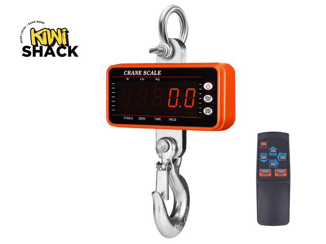 Digital crane scale with remote control on a white background, featuring the Kiwi Shack brand.