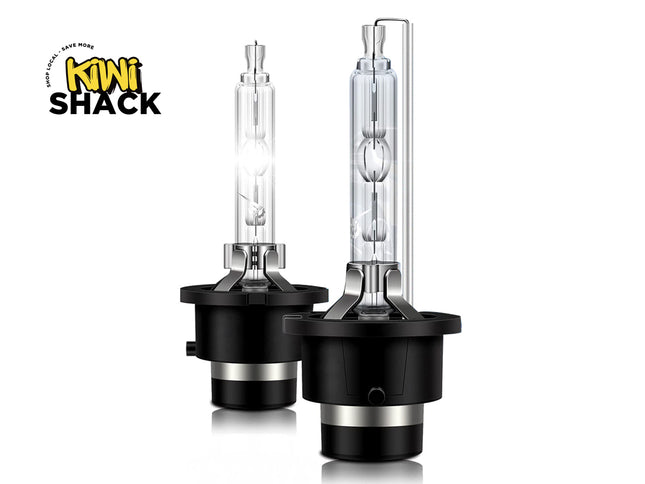 Two car headlight bulbs with black casings on a white background, featuring the Kiwi Shack logo.