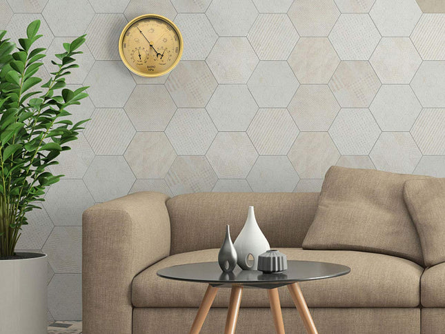 Living room with beige sofa, hexagonal tiled wall, and decorative items.