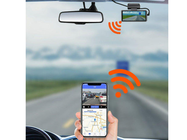 Car dashboard with a rearview mirror, GPS device, and smartphone displaying a map app.