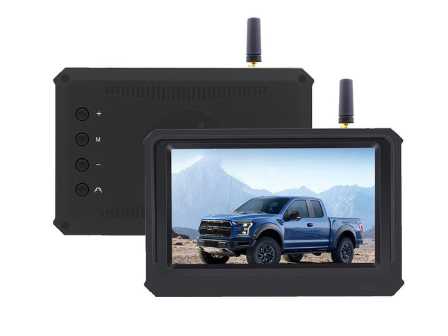 Monitor displaying a blue truck in a desert landscape with a black control panel on a white background