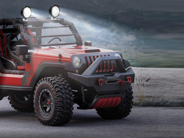Red off-road vehicle with large headlights on a rocky terrain