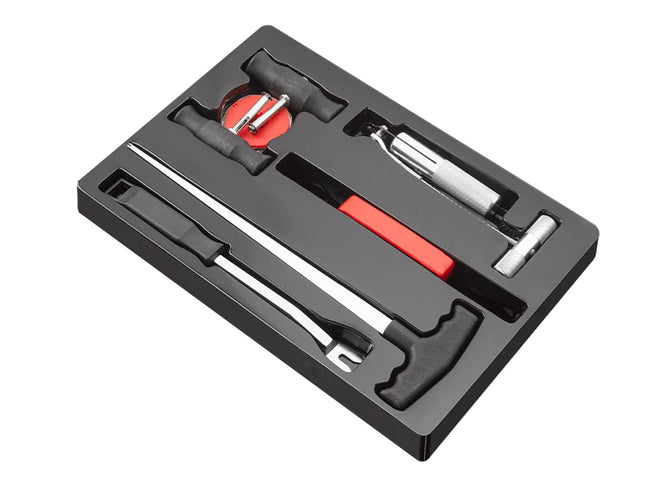 Tool kit with various tools in a black case on a white background