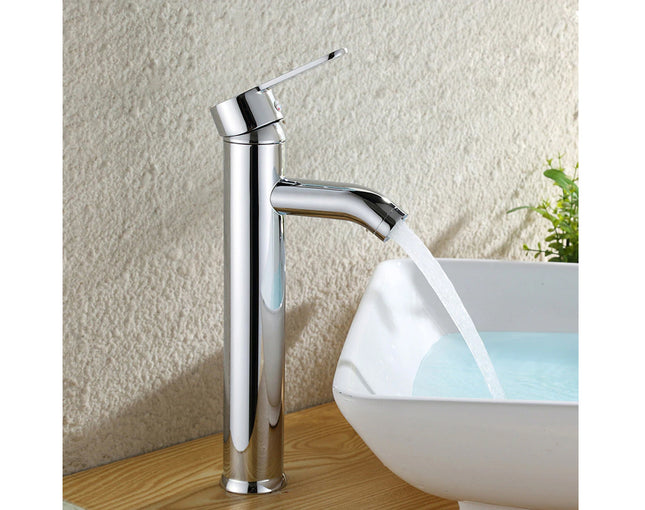Chrome faucet with water flowing into a white sink against a textured wall.