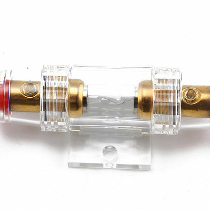 Clear mechanical component with brass and red parts on a white background