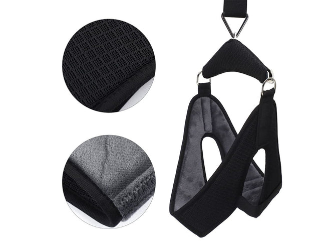 Black pet harness with close-up details on a white background