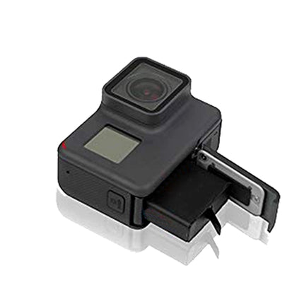 Black camera with a clip on a white background