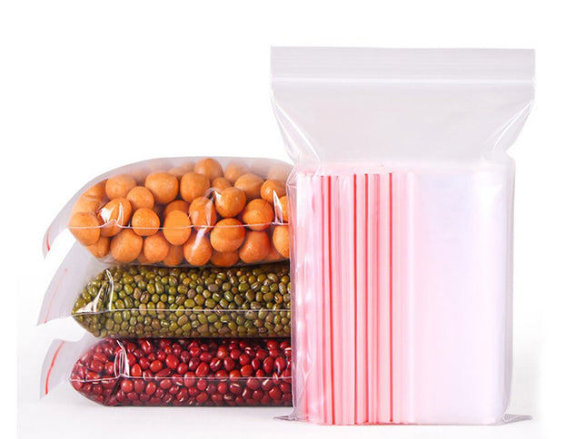 Clear plastic bags with different contents on a white background