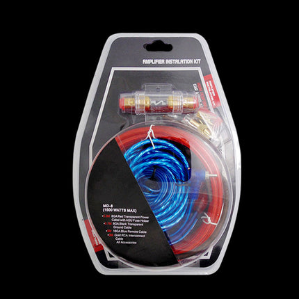 Packaged amplifier installation kit with blue and red cable on a black background