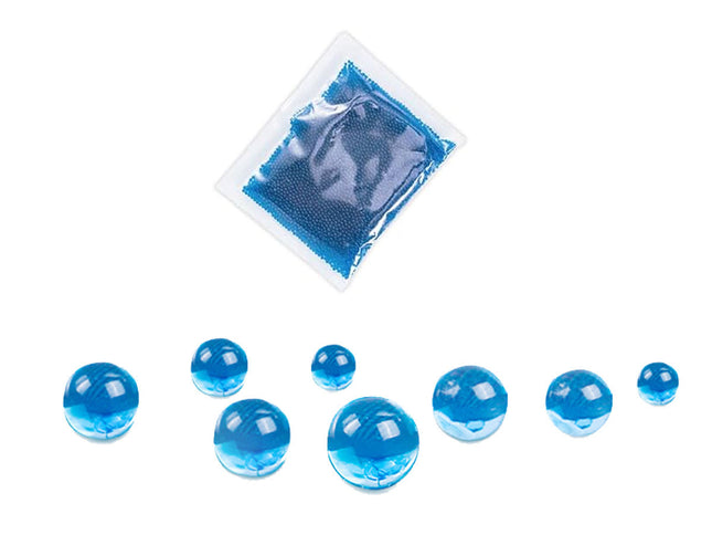 Blue gel packs and beads on a white background