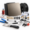 An assortment of 3D printer parts and maintenance accessories, including print beds, filament rolls, a hotend assembly, various nozzles, tubes, a digital caliper, tools, and connectors on a white background.