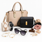 An assortment of women's fashion accessories, including handbags, watches, sunglasses, bracelets, hair clips, and scrunchies on a white background.