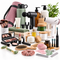 An assortment of wellness, self-care, and beauty products, including a yoga mat, water bottle, massage gun, skincare items, makeup, hair dryer, electric toothbrush, and beauty tools on a white background.