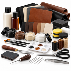 Leather working kit, leather pieces, dyes, waxes, thread, and tools on white.