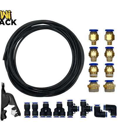A pneumatic fitting kit including a coil of black tubing, a tube cutter tool, eight threaded brass pneumatic connectors, and various push-to-connect union, tee, and elbow fittings against a white background. A "Kiwi Shack" logo appears in the top-left corner.