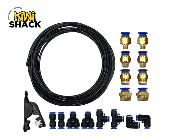 A pneumatic fitting kit including a coil of black tubing, a tube cutter tool, eight threaded brass pneumatic connectors, and various push-to-connect union, tee, and elbow fittings against a white background. A "Kiwi Shack" logo appears in the top-left corner.