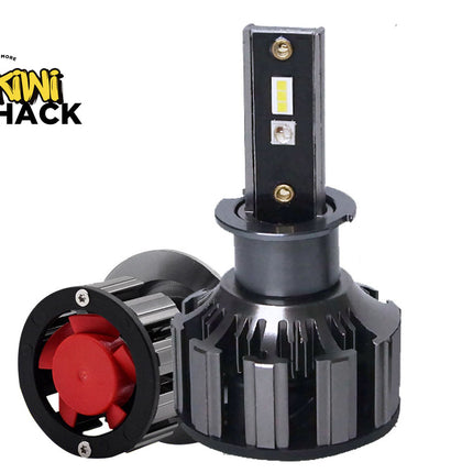 A black LED light bar with a ribbed metal heatsink and a red cooling fan attached to the side, shown on a plain white background with the Kiwi Shack logo in the top-left corner.