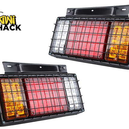 Pair of rectangular LED trailer tail lights protected by black metal grilles, with the Kiwi Shack logo in the top left.