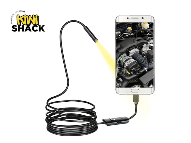 Kiwi Shack endoscope with smartphone displaying engine inspection on a white background