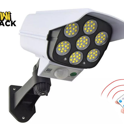 Security camera with LED lights and a remote control, branded as Kiwi Shack.