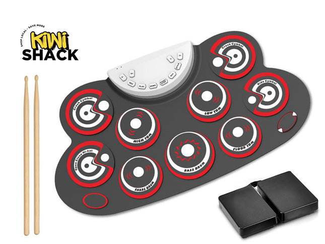 Electronic drum pad with red and white circles and wooden drumsticks on a white background, featuring the Kiwi Shack brand.