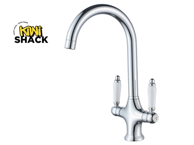 Chrome kitchen faucet with white handles on a white background, featuring the Kiwi Shack logo.