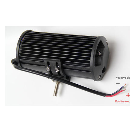 Black electrical component with labeled positive and negative electrodes on a white background