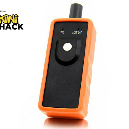 Orange electronic device with black screen on a white background, featuring the Kiwi Shack logo.