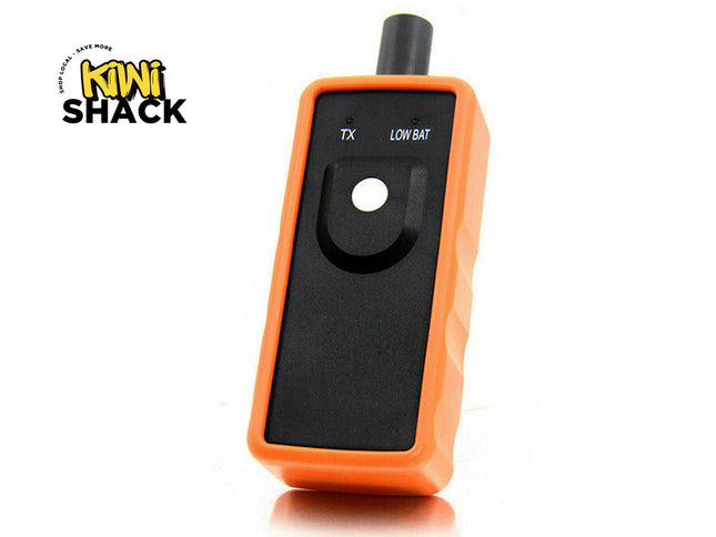Orange electronic device with black screen on a white background, featuring the Kiwi Shack logo.