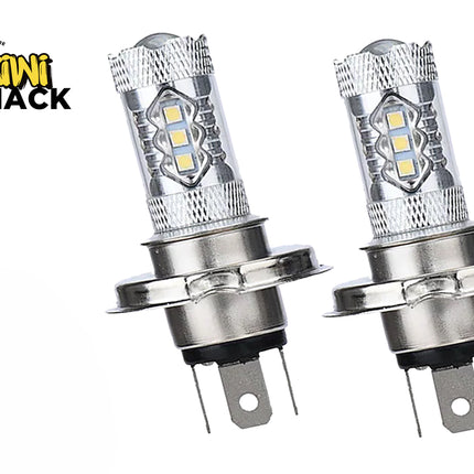 A pair of H4 LED headlight bulbs featuring silver metal housings, surface-mounted LED chips along the upper shaft, mounting collars, and bottom electrical connector pins against a white background, featuring the "Kiwi Shack" logo in the upper left corner.