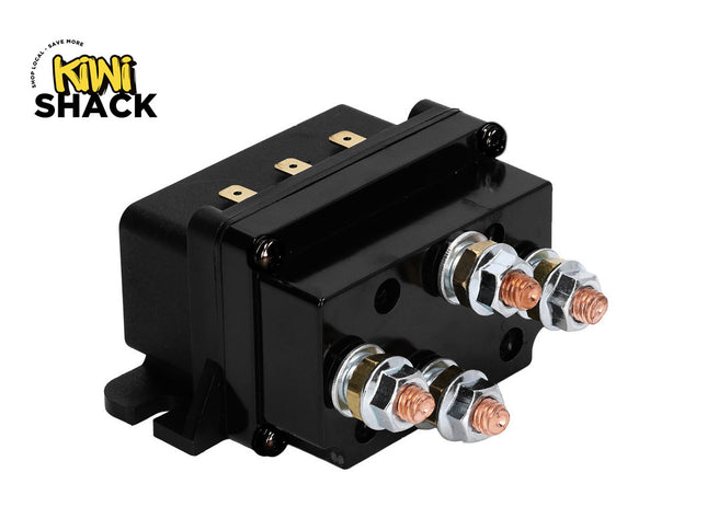 A black electrical contactor or relay component with four copper terminal posts and silver metal connectors, shown on a white background with the Kiwi Shack logo in the top-left corner.