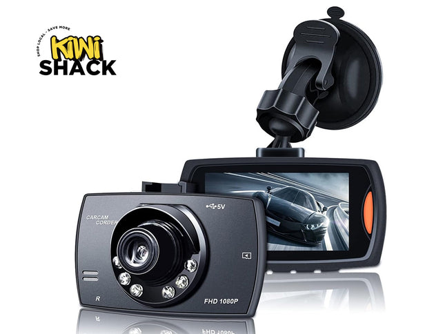Car dashboard camera with screen and suction cup, branded 'Kiwi Shack'.