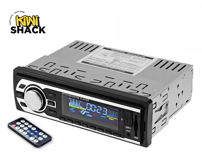 A single-DIN digital media car stereo with an MP3 player, color LCD screen, USB and SD card ports, and a remote control, featuring the "Kiwi Shack" logo in the top-left corner.