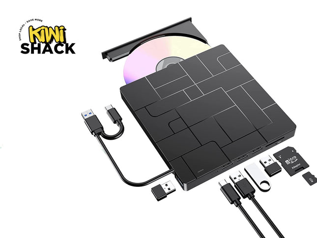 Black external portable DVD burner drive with open tray, shown with USB cables, a USB flash drive, and an SD card on a white background. Kiwi Shack logo is visible in the top-left corner.